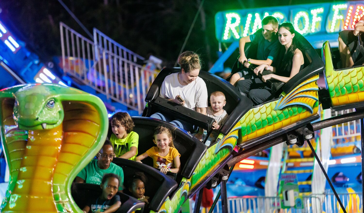Fairground Rides High Bright lights of county fair shine on thrill rides, high-flying stunts