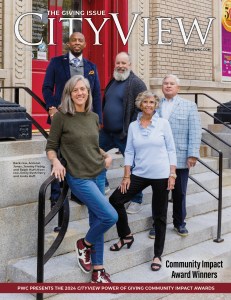 Five people stand on the front steps of the Arts Council of Fayetteville/Cumberland County.