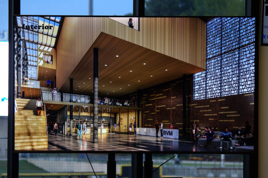 A rendering of the interior of a large museum lobby with the names of key Black figures in American history on the walls